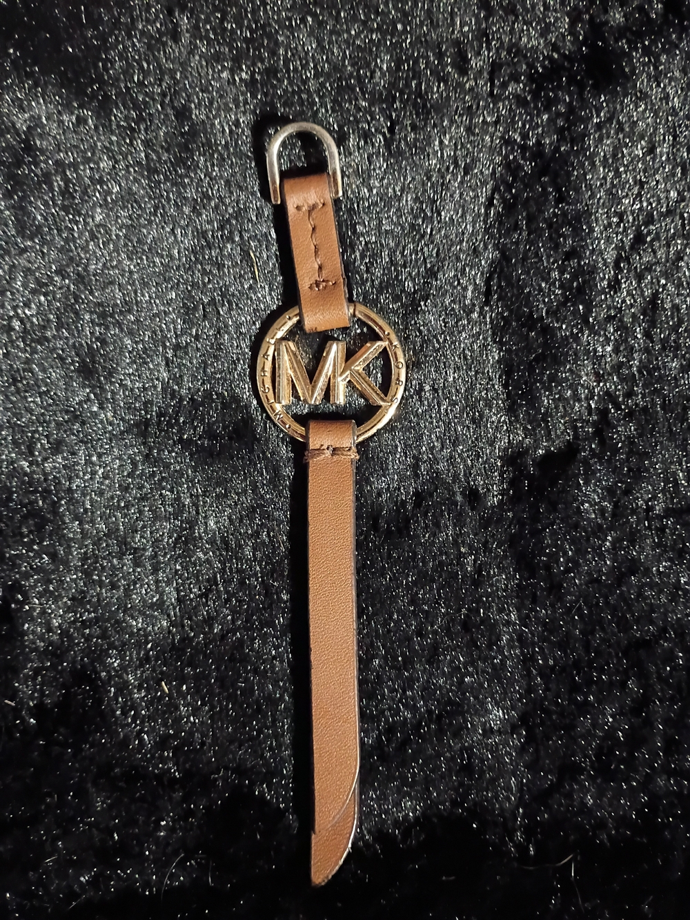 Michael Kors handbag charm gold-toned MK logo medallion on brown leather Strap